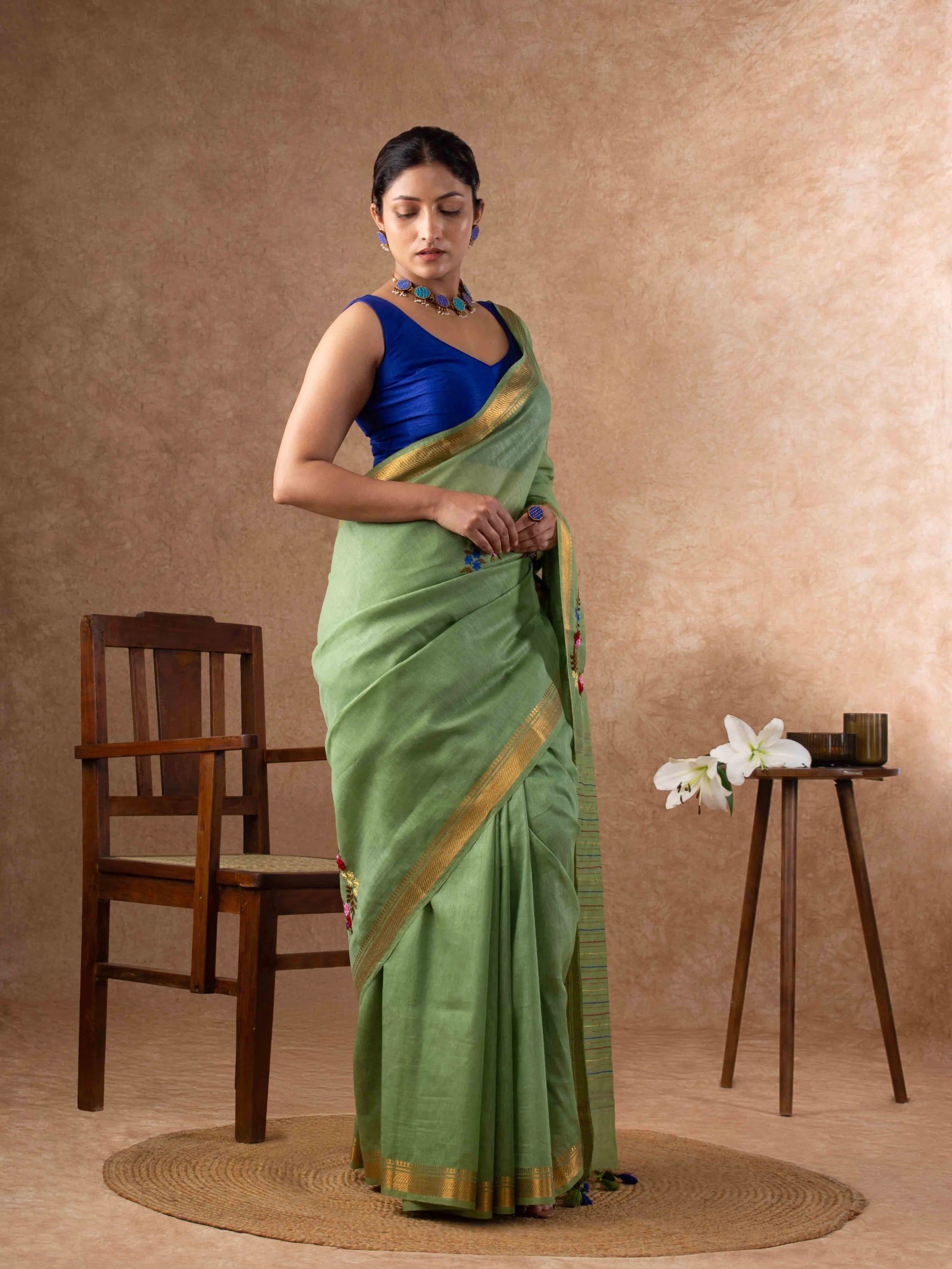 Velvety Linen Silk Saree in Leaf Green with Floral Embroidery