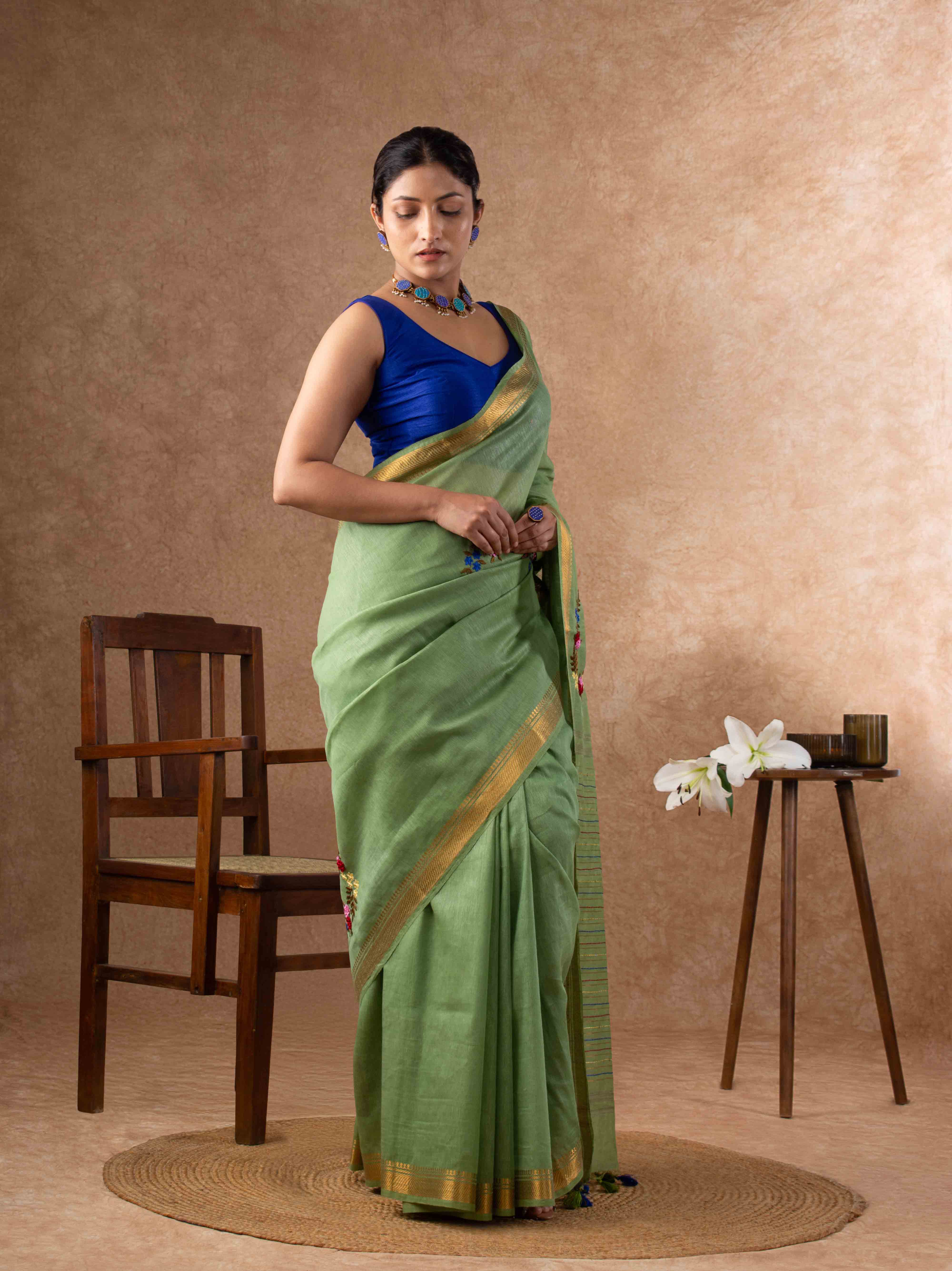 Velvety Linen Silk Saree in Leaf Green with Floral Embroidery