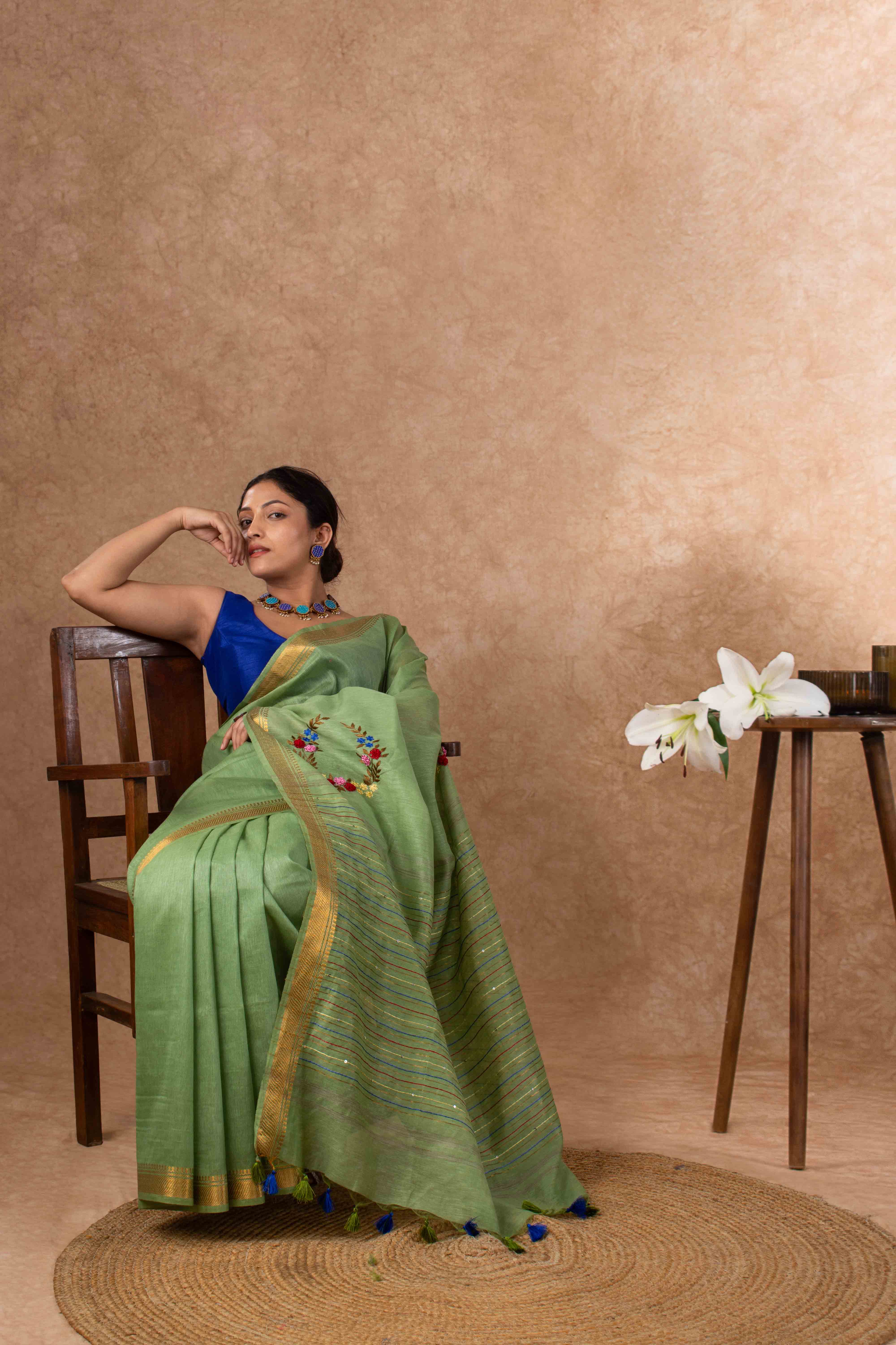 Velvety Linen Silk Saree in Leaf Green with Floral Embroidery